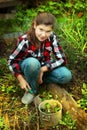 preteen beautiful girl cultivate sprouts in spring market-garden Royalty Free Stock Photo