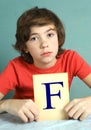 Preteen boy with bad mark F - failure Royalty Free Stock Photo