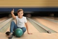 Preteen boy with ball in bowling Royalty Free Stock Photo