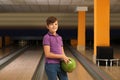 Preteen boy with ball in bowling Royalty Free Stock Photo