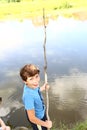 Preteen boy with fishing self made rode