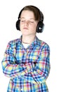 Preteen boy listening to music with headphones with eyes closed Royalty Free Stock Photo