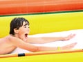 Preteen boy in open air aqua park Royalty Free Stock Photo