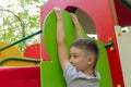 A preteen boy playing on a children`s playground. Royalty Free Stock Photo