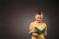 preteen boy reading book isolated Royalty Free Stock Photo