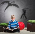 Preteen boy reading a book Royalty Free Stock Photo