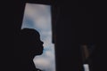 Preteen boy on a street in a big city next to a high-rise building alone. Royalty Free Stock Photo