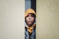 Preteen boy on a street in a big city next to a high-rise building alone. Royalty Free Stock Photo