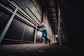 Preteen boy on a street in a big city next to a high-rise building alone. Royalty Free Stock Photo