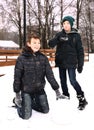 Preteen boys make snow ball