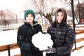 Preteen boys make snow ball