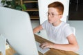 preteen ginger hair boy using computer Royalty Free Stock Photo