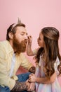 Preteen girl applying eyeshadow on tattooed Royalty Free Stock Photo