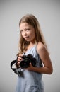 Preteen girl with a big camera Royalty Free Stock Photo