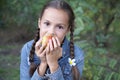 Preteen girl biting a pear Royalty Free Stock Photo