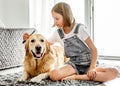 Girl with golden retriever dog Royalty Free Stock Photo