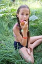Preteen girl eatting apple
