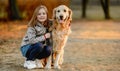 Preteen girl with golden retriever dog Royalty Free Stock Photo