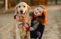 Preteen girl with golden retriever dog Royalty Free Stock Photo