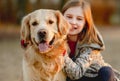 Preteen girl with golden retriever dog Royalty Free Stock Photo