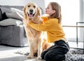 Preteen girl with golden retriever dog Royalty Free Stock Photo