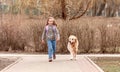 Preteen girl with golden retriever dog Royalty Free Stock Photo