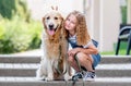 Preteen girl with golden retriever dog Royalty Free Stock Photo