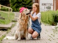 Preteen girl with golden retriever dog Royalty Free Stock Photo