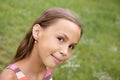 Preteen girl on grass background Royalty Free Stock Photo