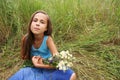 Preteen girl on grass background