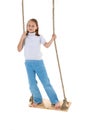 Preteen girl having fun on rope swing Royalty Free Stock Photo