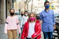 Preteen girl in pink protective mask walking outdoors