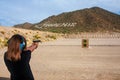 Preteen Girl Shooting a 9mm Pistol at a Shooting Range Near Phoenix Arizona Royalty Free Stock Photo
