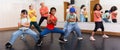 Preteen girls and boys hip hop dancers doing dance workout