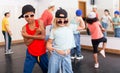 Preteen girls and boys hip hop dancers doing dance workout Royalty Free Stock Photo