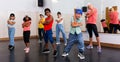 Preteen girls and boys hip hop dancers doing dance workout Royalty Free Stock Photo