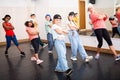 Preteen girls and boys hip hop dancers doing dance workout Royalty Free Stock Photo