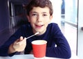 Preteen handsome boy with cappuccino