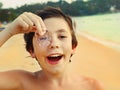 Preteen handsome boy with jellyfish Royalty Free Stock Photo