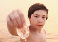 Preteen handsome boy with jellyfish Royalty Free Stock Photo