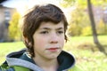 Preteen handsome boy outdoor autumn portrait