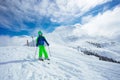 Preteen handsome boy ski downhill on mountain slope Royalty Free Stock Photo