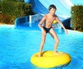 Preteen little boy in open air aqua park Royalty Free Stock Photo