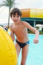 Preteen little boy in open air aqua park Royalty Free Stock Photo