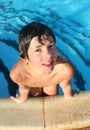 Preteen little boy in open air swimming pool Royalty Free Stock Photo