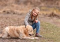 Preteen girl with golden retriever dog Royalty Free Stock Photo