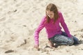 Preteen playing in sand on Oregon beach