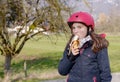 Preteen with roller skate helmet, eat banana