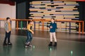 Preteen roller skaters practicing skating