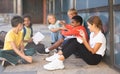 Preteen schoolmates funning near school during break